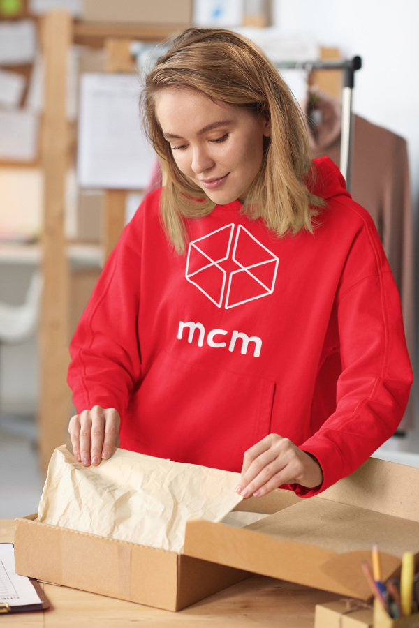 https://www.mcml.com.au/wp-content/uploads/2022/11/hoodie-mockup-featuring-a-young-woman-packing-some-items-for-shipping-45669-r-el2-600x900.png